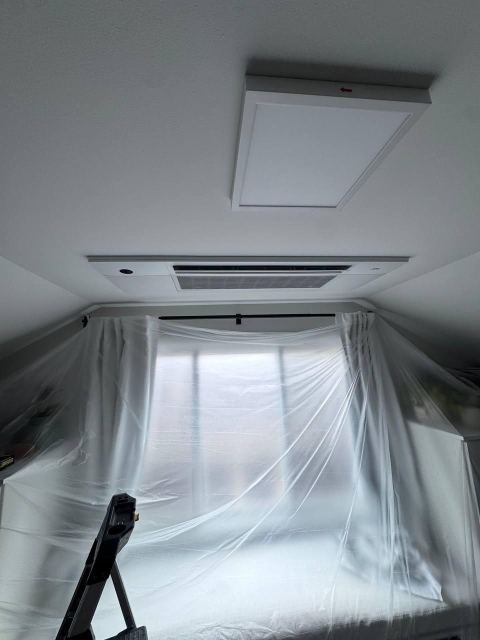 Ceiling cassette installation in progress