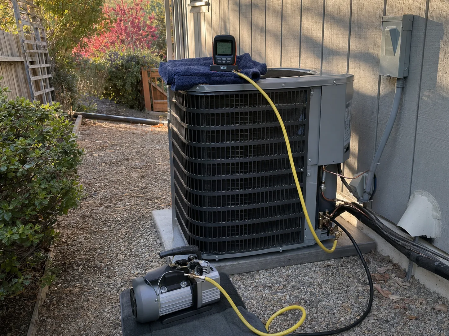 New residential AC condenser installed beside a home in Castro Valley, Bay Area