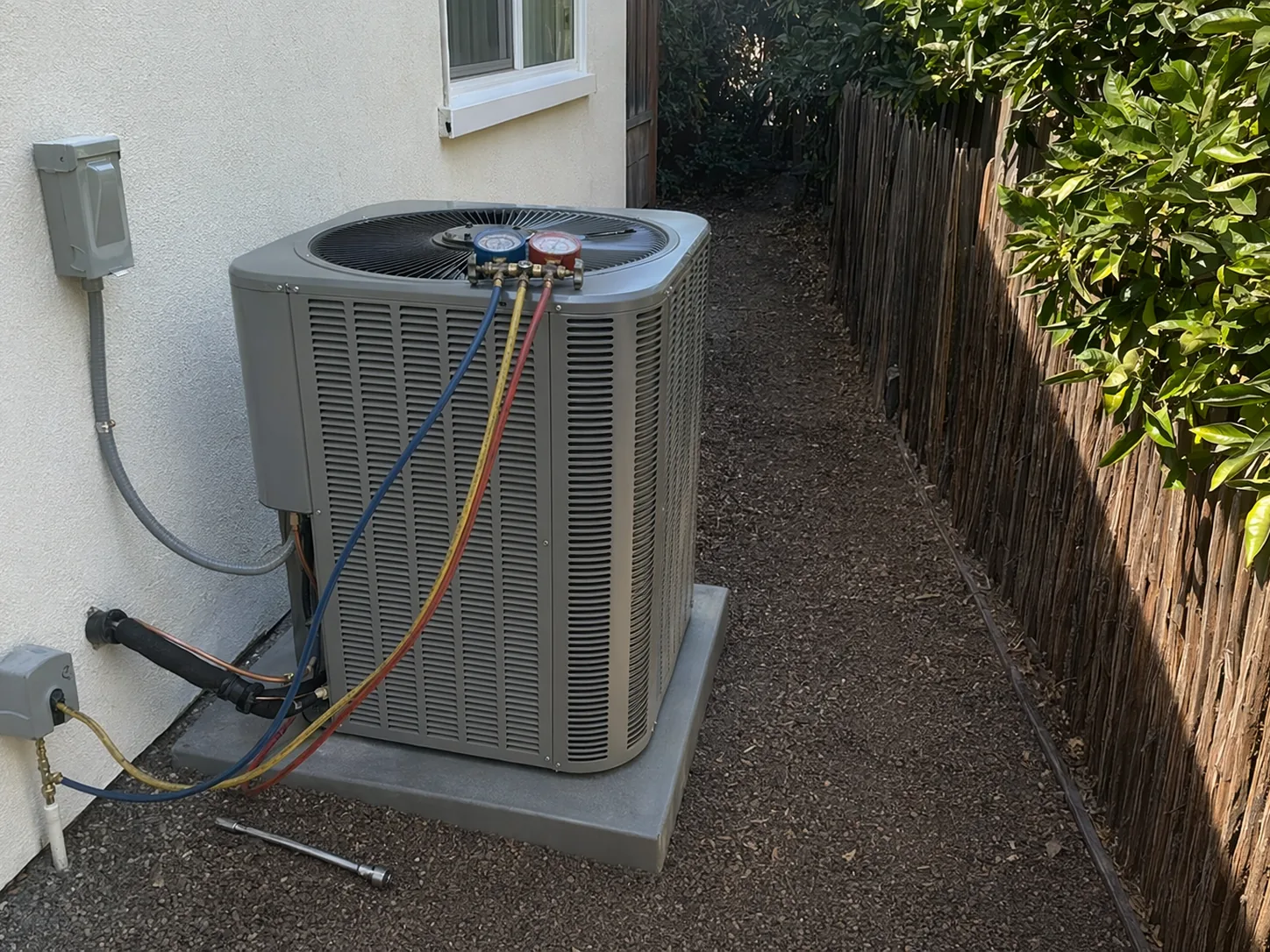 New residential AC condenser installed beside a home in Concord, Bay Area