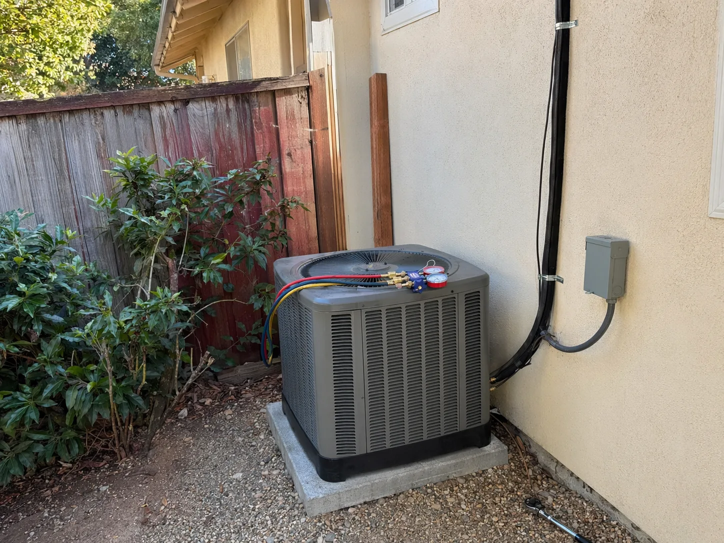 New residential AC condenser installed beside a home in Fremont, Bay Area