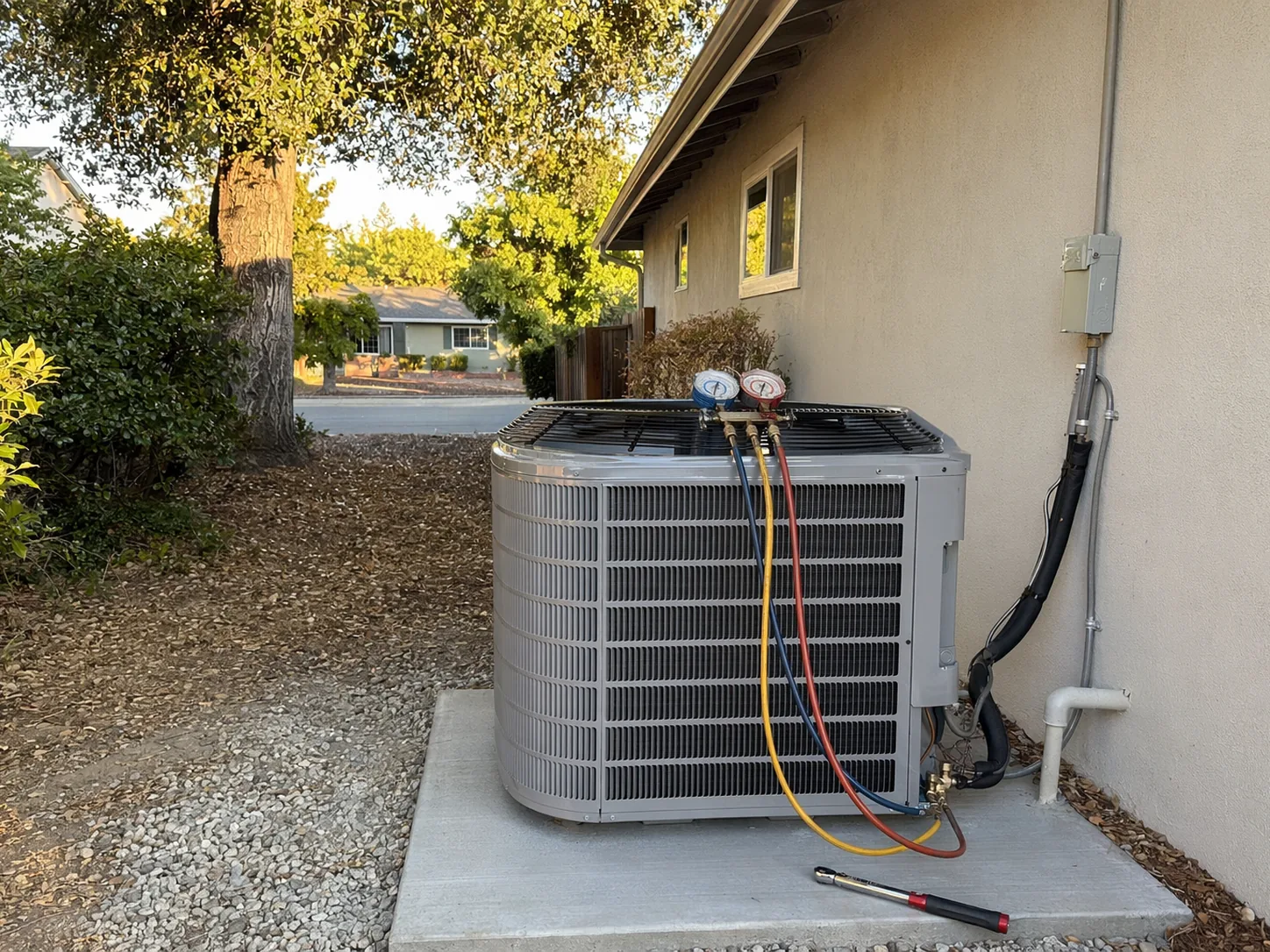 New residential AC condenser installed beside a home in Pleasanton, Bay Area