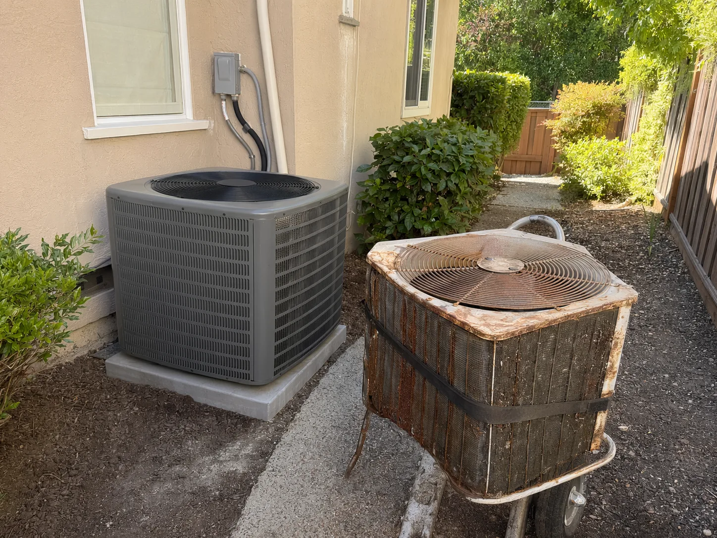New residential AC condenser installed beside a home in San Ramon, Bay Area