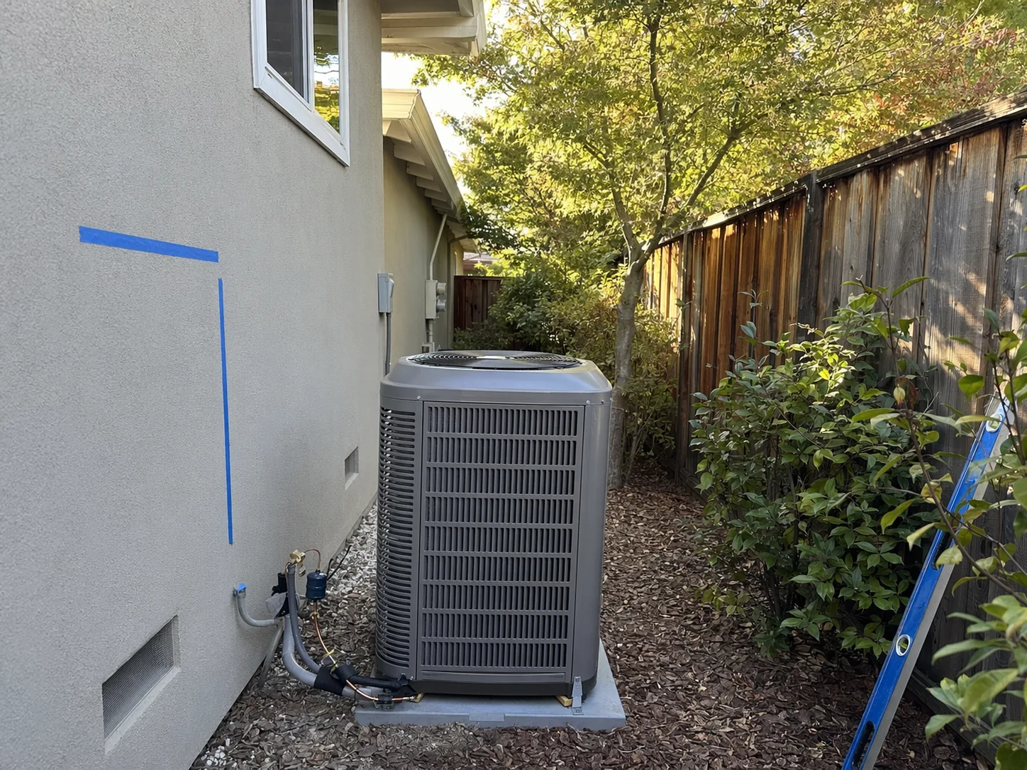 New residential AC condenser installed beside a home in Walnut Creek, Bay Area