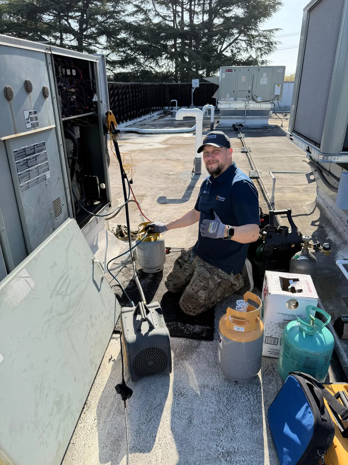 HVAC technician installing rooftop unit